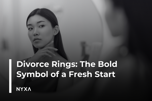 An image of a woman looking in the mirror at the woman's hand wearing a bold, geometric sterling silver ring, symbolizing empowerment and new beginnings.