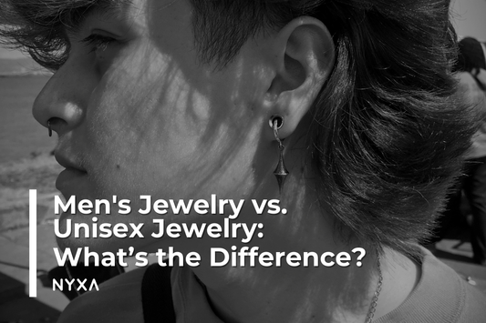 Close-up of person wearing unisex sterling silver earring, featuring NYXA's geometric design, with overlay text: Men's Jewelry vs. Unisex Jewelry: What’s the Difference?