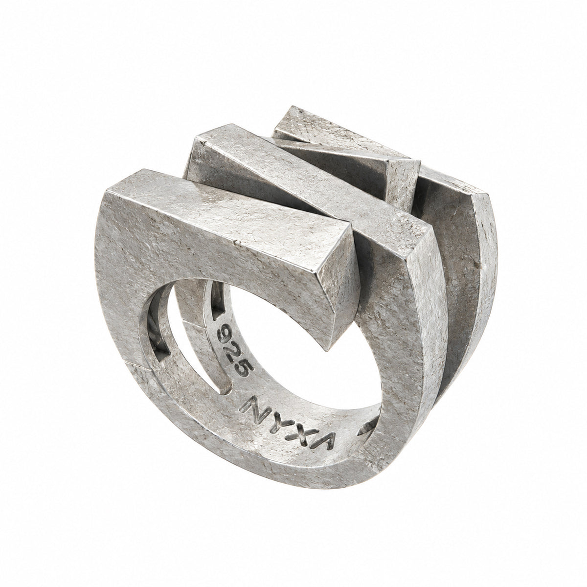 Three-quarter view of the Apollo sterling silver ring showing geometric bands and interior NYXA and 925 stamps.
